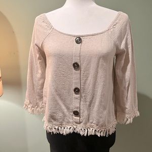 Off the shoulder Cream Millibon Top with fringe detailing.